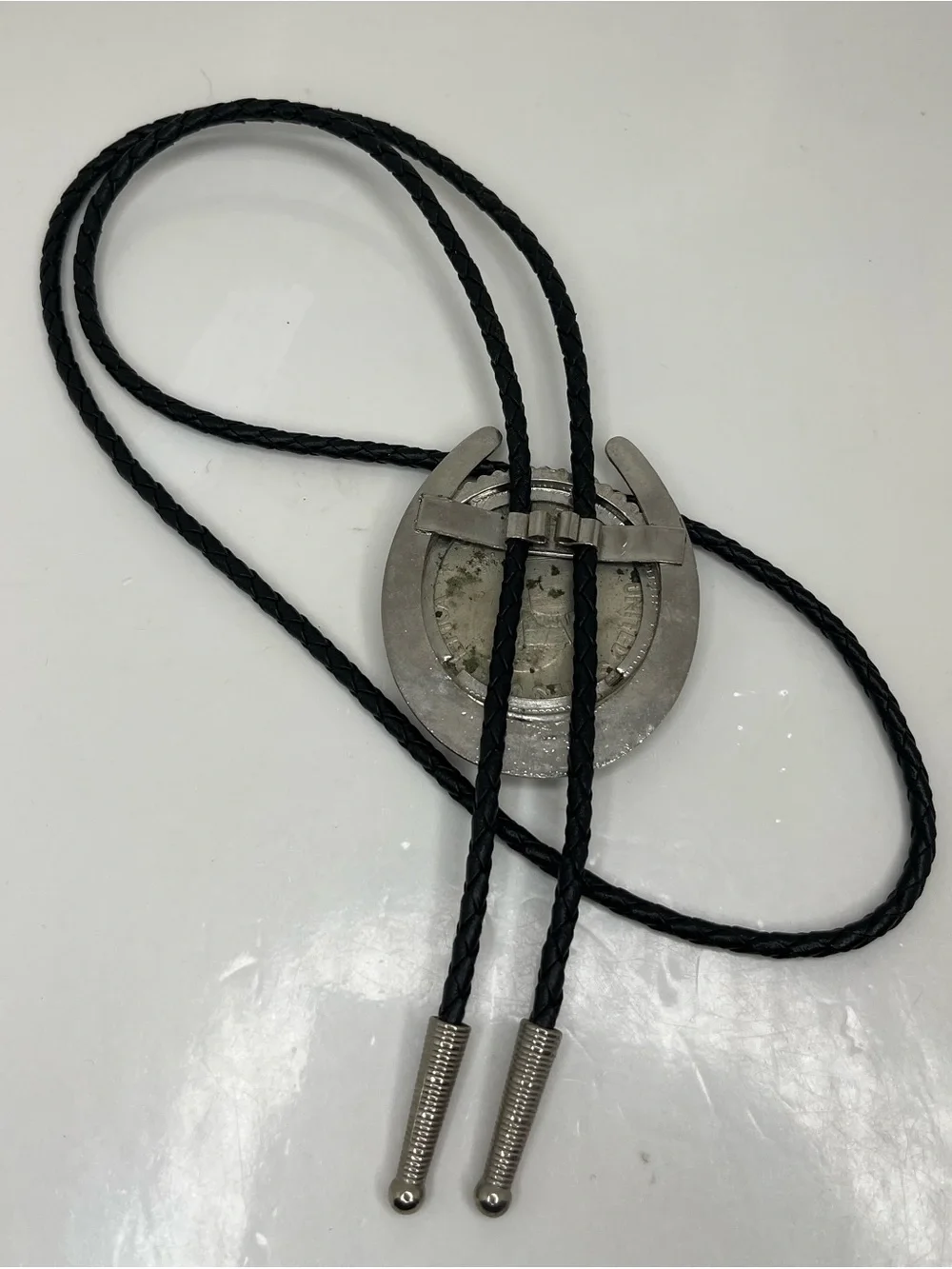 Black Braided Leather Bolo Tie with Silver Horseshoe and Coin Medallion